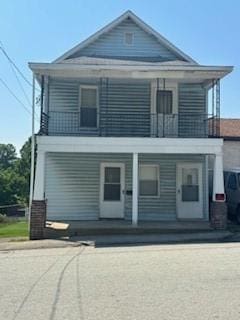 202 S Quarry St, East Huntingdon, PA 15666 - view of front of home featuring a balcony and a porch