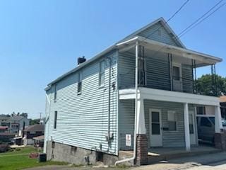 202 S Quarry St, East Huntingdon, PA 15666 - view of side of home featuring covered porch