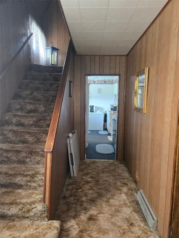 114 Dry Knob Rd, Georges Twp, PA 15478 - hall featuring radiator heating unit, wooden walls, and carpet flooring