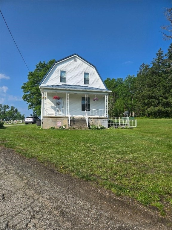 114 Dry Knob Rd, Georges Twp, PA 15478 - view of front of home with a porch, a gambrel roof, and a front yard