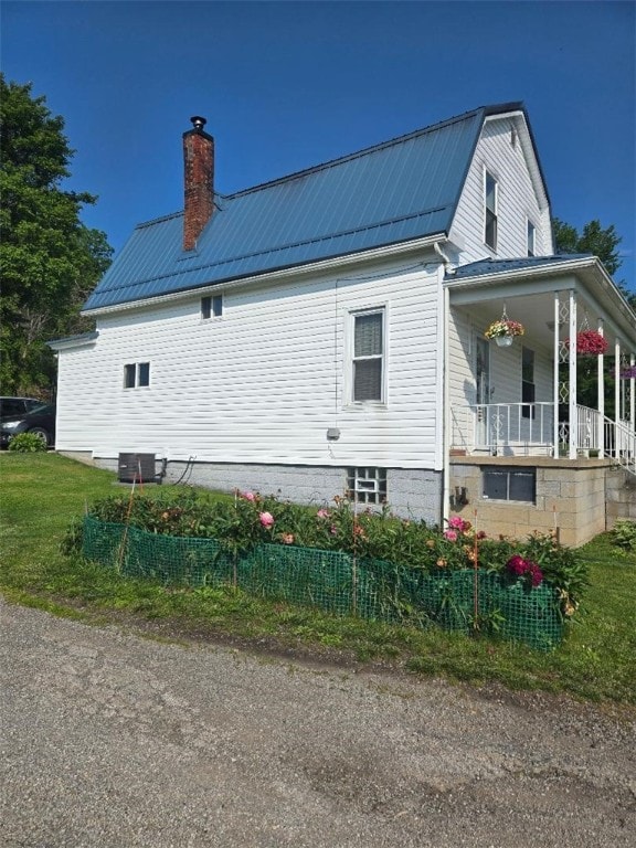 114 Dry Knob Rd, Georges Twp, PA 15478 - view of side of property with a porch, a chimney, metal roof, central air condition unit, and a gambrel roof