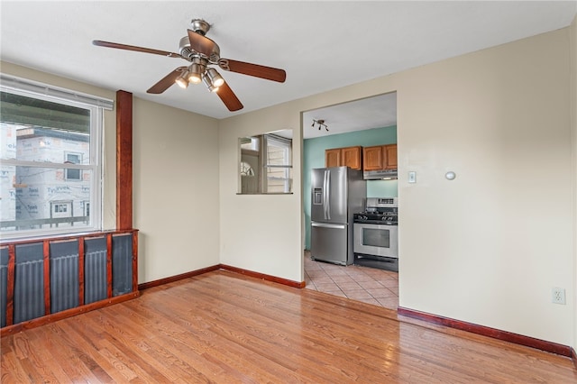 1913 Saint Paul St, South Side, PA 15203 - unfurnished room featuring baseboards, light wood-style flooring, and a ceiling fan