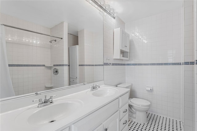 1913 Saint Paul St, South Side, PA 15203 - full bathroom featuring tile patterned flooring, double vanity, tile walls, toilet, and tiled shower