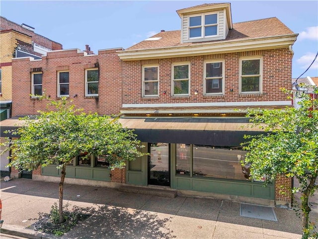 2512 E Carson St, South Side, PA 15203 - view of front facade featuring brick siding and roof with shingles