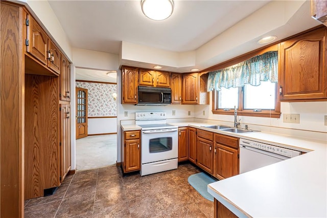 28 Saddlebrook Dr, Hempfield Twp Wml, PA 15601 - kitchen with white appliances, a sink, wallpapered walls, brown cabinetry, and light countertops