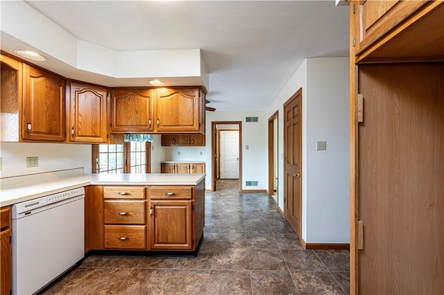 28 Saddlebrook Dr, Hempfield Twp Wml, PA 15601 - kitchen featuring dishwasher, brown cabinetry, a peninsula, and light countertops
