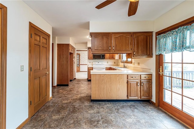 28 Saddlebrook Dr, Hempfield Twp Wml, PA 15601 - kitchen featuring black microwave, white range with electric stovetop, a sink, a peninsula, and a ceiling fan
