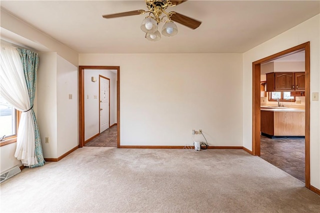 28 Saddlebrook Dr, Hempfield Twp Wml, PA 15601 - empty room featuring carpet, ceiling fan, a sink, and baseboards