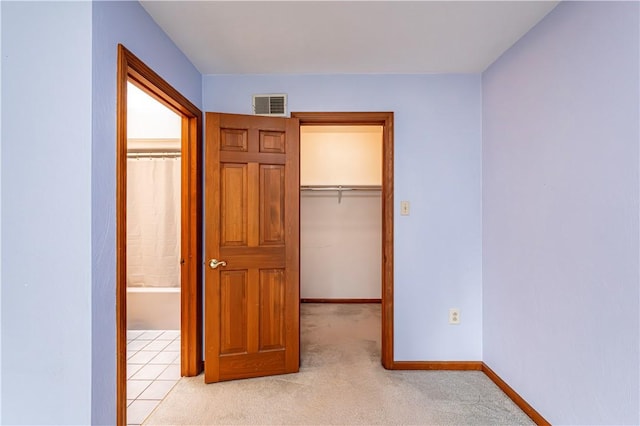 28 Saddlebrook Dr, Hempfield Twp Wml, PA 15601 - unfurnished bedroom with a walk in closet, a closet, baseboards, and light carpet