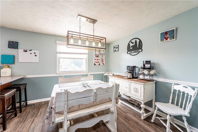 1941 Ivanhoe Dr, North Huntingdon, PA 15642 - dining space featuring wood finished floors and a textured ceiling