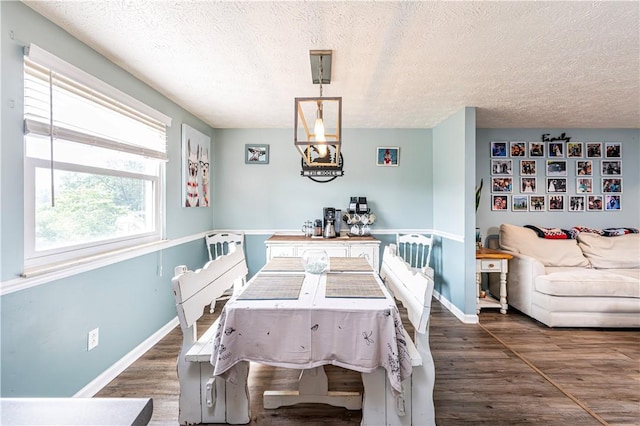 1941 Ivanhoe Dr, North Huntingdon, PA 15642 - dining room with a textured ceiling, wood finished floors, and baseboards