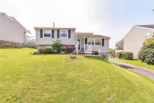 1941 Ivanhoe Dr, North Huntingdon, PA 15642 - split level home with a porch and a front yard