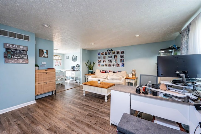 1941 Ivanhoe Dr, North Huntingdon, PA 15642 - living area featuring a textured ceiling, wood finished floors, recessed lighting, an office area, and baseboards