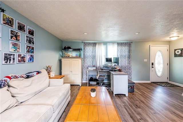 1941 Ivanhoe Dr, North Huntingdon, PA 15642 - living room featuring a textured ceiling, wood finished floors, a desk, baseboards, and recessed lighting