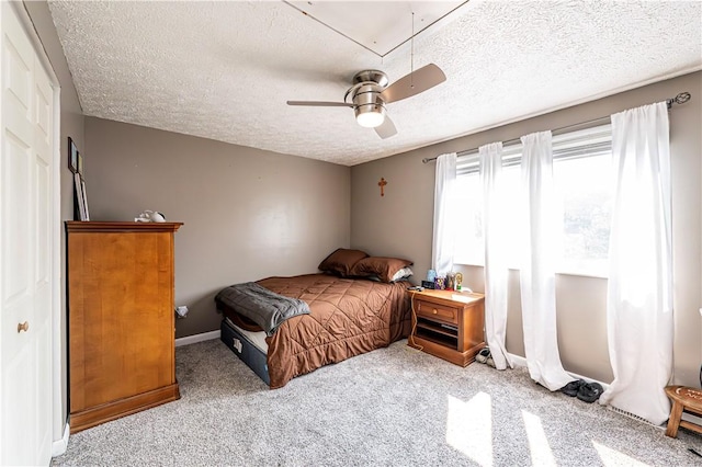 1941 Ivanhoe Dr, North Huntingdon, PA 15642 - carpeted bedroom with a textured ceiling, a ceiling fan, baseboards, and attic access