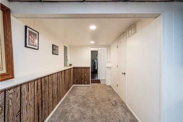 1941 Ivanhoe Dr, North Huntingdon, PA 15642 - hallway featuring carpet flooring, wooden walls, and a decorative wall