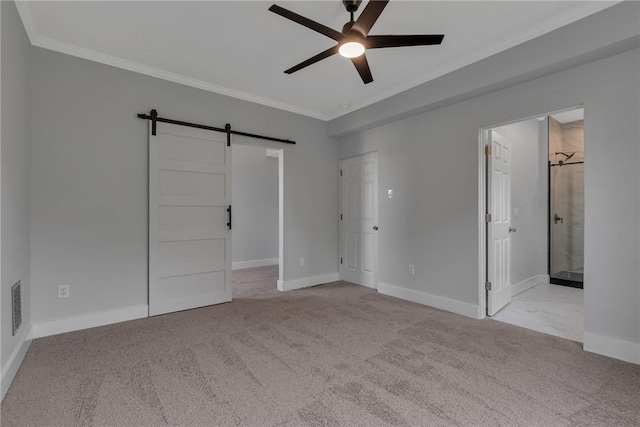615 Cliff Ave, Bellevue, PA 15202 - unfurnished bedroom with a barn door, crown molding, carpet flooring, a ceiling fan, and a spacious closet