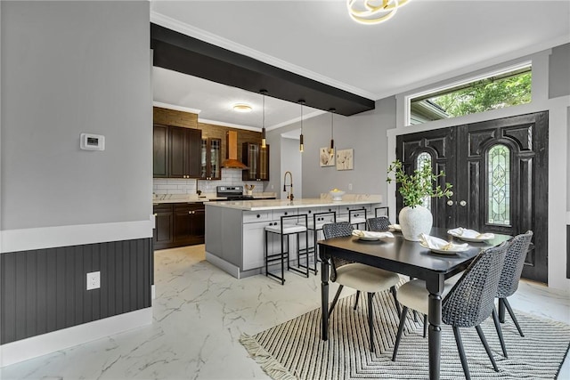 615 Cliff Ave, Bellevue, PA 15202 - dining room featuring light marble finish flooring and crown molding