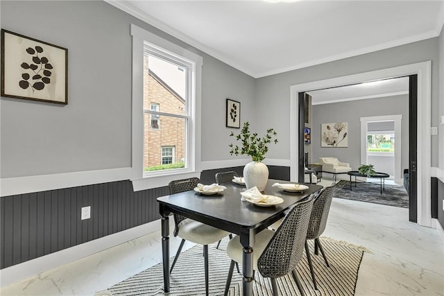 615 Cliff Ave, Bellevue, PA 15202 - dining space with light marble finish flooring, crown molding, wainscoting, and healthy amount of natural light