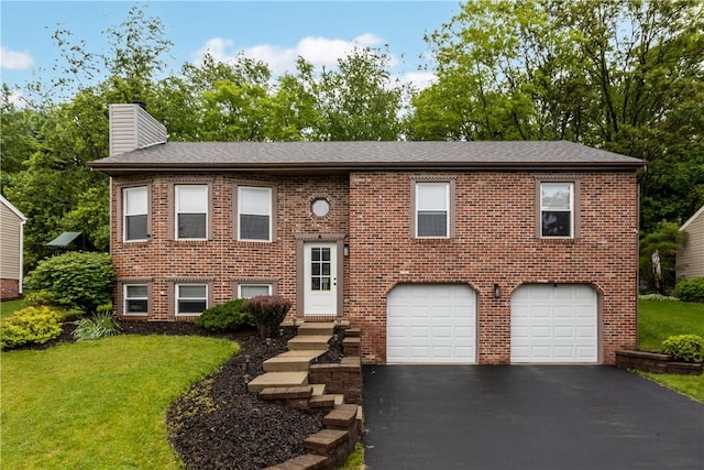 509 Cresthaven Dr, Plum Boro, PA 15239 - raised ranch featuring a garage, a chimney, driveway, brick siding, and a front yard