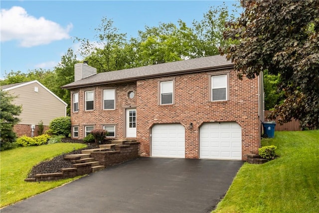 509 Cresthaven Dr, Plum Boro, PA 15239 - split foyer home with an attached garage, driveway, a chimney, a front lawn, and brick siding