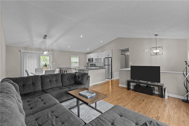 509 Cresthaven Dr, Plum Boro, PA 15239 - living area featuring vaulted ceiling, a chandelier, light wood finished floors, baseboards, and recessed lighting