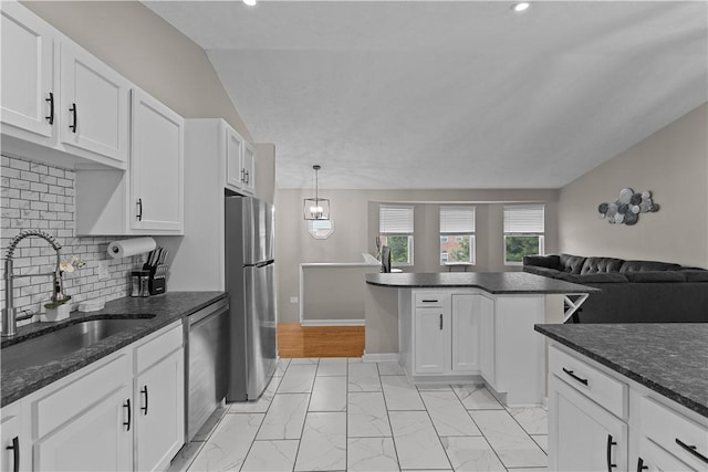 509 Cresthaven Dr, Plum Boro, PA 15239 - kitchen featuring stainless steel appliances, a sink, light marble finish floors, open floor plan, and white cabinetry