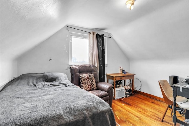 439 Ford St, West Mifflin, PA 15122 - bedroom with light wood finished floors, vaulted ceiling, and baseboards