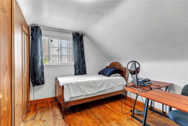 439 Ford St, West Mifflin, PA 15122 - bedroom with hardwood / wood-style floors, lofted ceiling, and baseboards