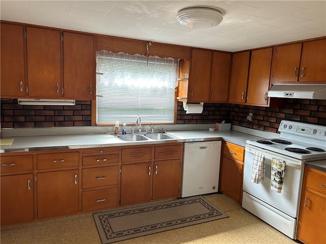 1214 Ridge Blvd, Dunbar Twp, PA 15425 - kitchen featuring white appliances, under cabinet range hood, a sink, decorative backsplash, and brown cabinetry