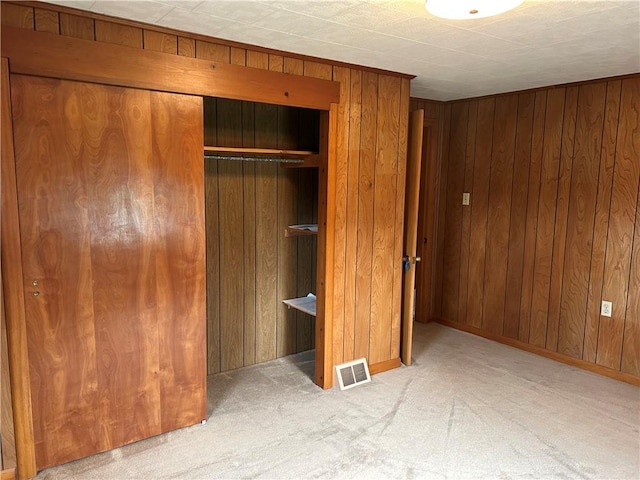 1214 Ridge Blvd, Dunbar Twp, PA 15425 - unfurnished bedroom with carpet flooring, wooden walls, and a closet