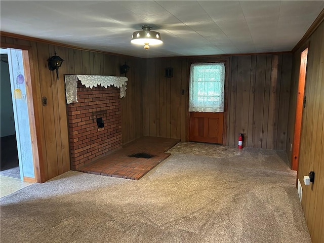 1214 Ridge Blvd, Dunbar Twp, PA 15425 - entrance foyer with carpet, wooden walls, and a brick fireplace