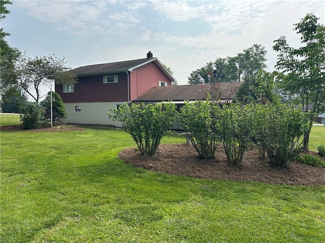 1214 Ridge Blvd, Dunbar Twp, PA 15425 - view of side of home with a chimney and a lawn