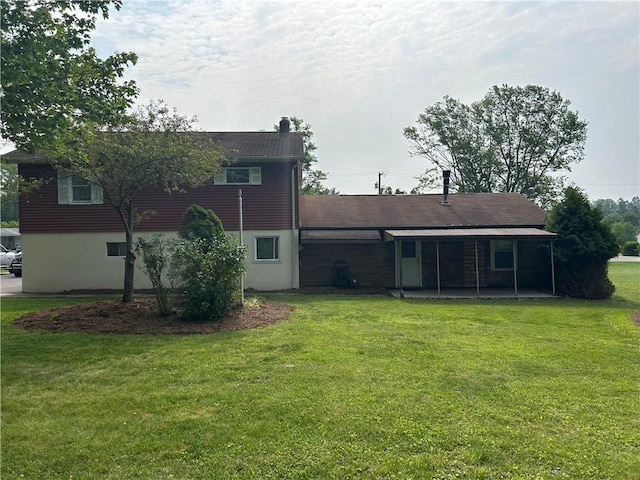 1214 Ridge Blvd, Dunbar Twp, PA 15425 - rear view of property with a chimney, a yard, and a patio area