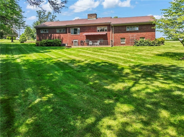 1033 Colvin Dr, Brighton Twp, PA 15009 - back of property featuring brick siding, a yard, and a chimney