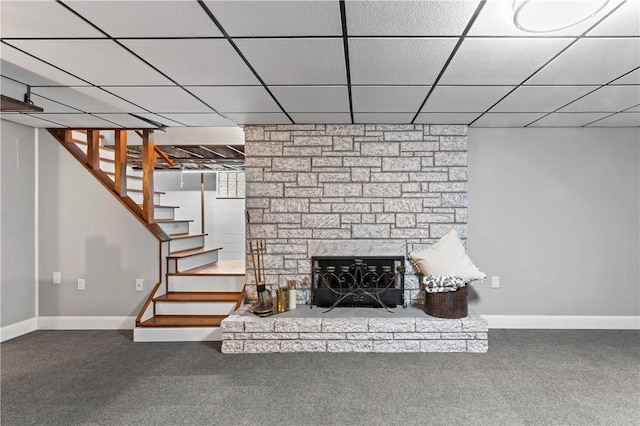 1033 Colvin Dr, Brighton Twp, PA 15009 - unfurnished living room with a stone fireplace, a paneled ceiling, baseboards, stairway, and carpet floors
