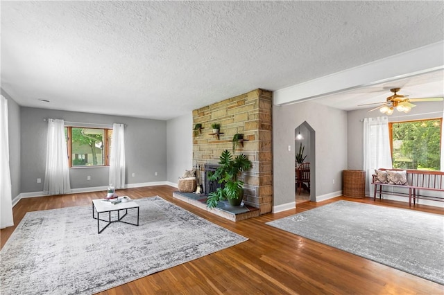 1033 Colvin Dr, Brighton Twp, PA 15009 - living room with a textured ceiling, plenty of natural light, wood finished floors, and baseboards