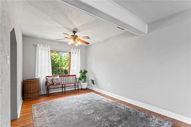 1033 Colvin Dr, Brighton Twp, PA 15009 - living area with a textured ceiling, ceiling fan, wood finished floors, and baseboards