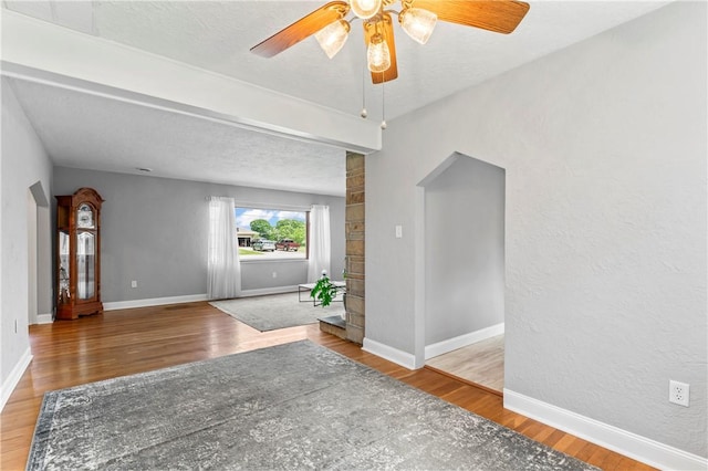 1033 Colvin Dr, Brighton Twp, PA 15009 - unfurnished room with a ceiling fan, wood finished floors, baseboards, and a textured ceiling