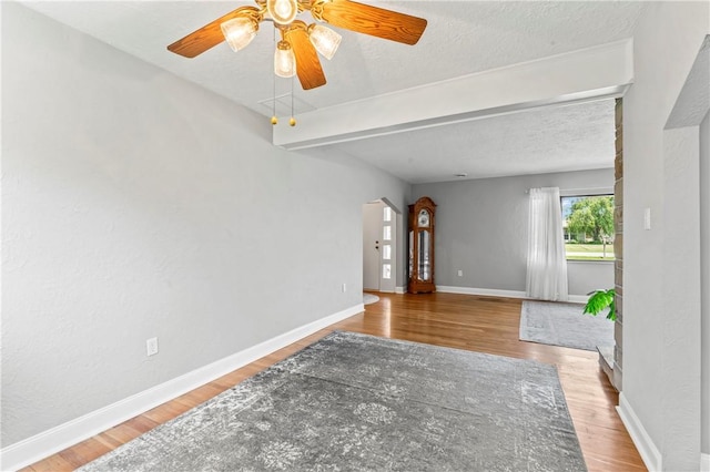 1033 Colvin Dr, Brighton Twp, PA 15009 - spare room with wood finished floors, a ceiling fan, baseboards, and a textured ceiling