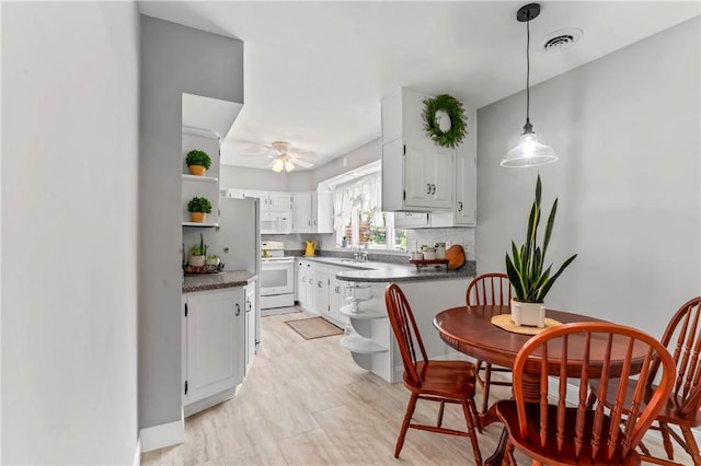 1033 Colvin Dr, Brighton Twp, PA 15009 - kitchen with open shelves, white appliances, dark countertops, and a ceiling fan