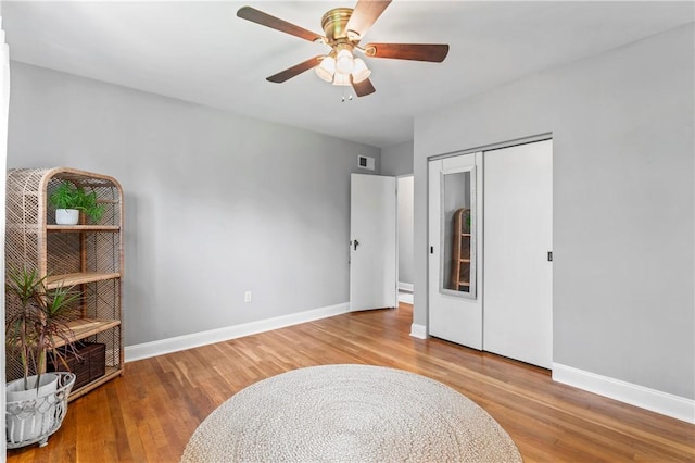 1033 Colvin Dr, Brighton Twp, PA 15009 - living area with wood finished floors, baseboards, and a ceiling fan