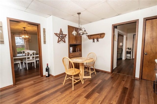 198 Gastown Rd, Plumcreek Twp, PA 15774 - dining room featuring a chandelier, a drop ceiling, dark wood-type flooring, and baseboards