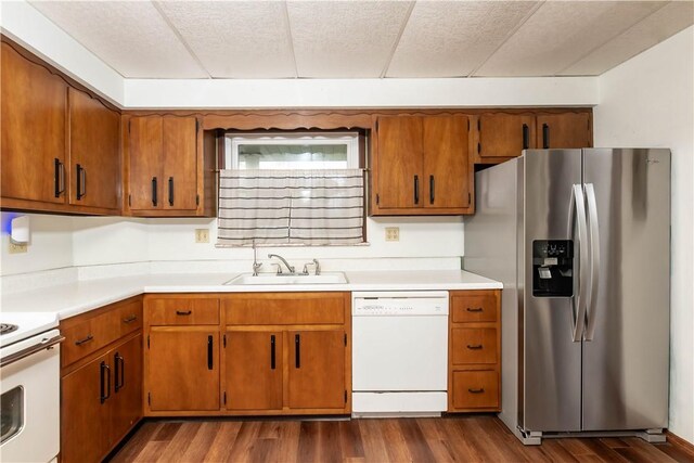 198 Gastown Rd, Plumcreek Twp, PA 15774 - kitchen featuring white appliances, a sink, light countertops, and dark wood-type flooring