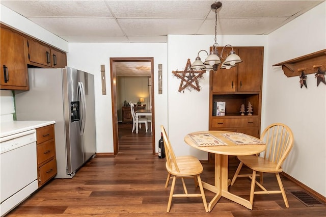 198 Gastown Rd, Plumcreek Twp, PA 15774 - dining room featuring dark wood-style floors, a chandelier, a drop ceiling, and baseboards