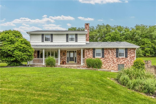375 Navaho Hollow Rd, Coolbaugh Twp, PA 15438 - traditional home featuring a chimney, a front yard, covered porch, and brick siding