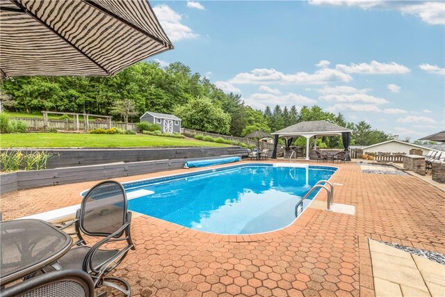 375 Navaho Hollow Rd, Coolbaugh Twp, PA 15438 - view of pool featuring a gazebo, a patio area, and view of wooded area