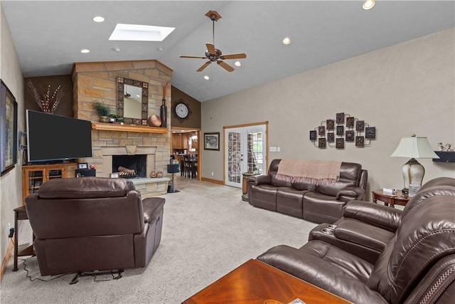 375 Navaho Hollow Rd, Coolbaugh Twp, PA 15438 - carpeted living room with a skylight, ceiling fan, a stone fireplace, high vaulted ceiling, and recessed lighting