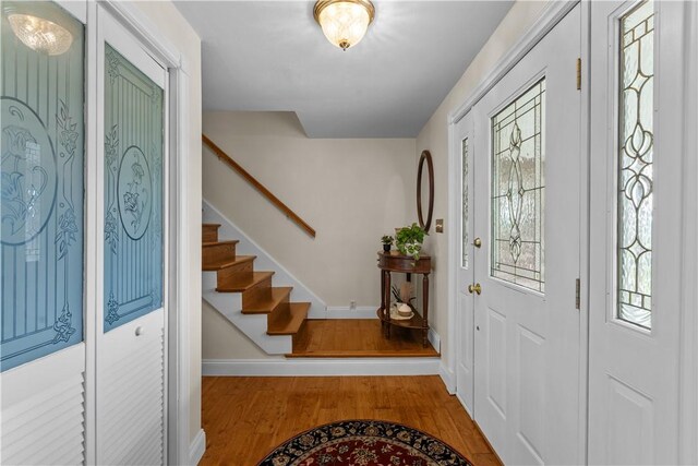 375 Navaho Hollow Rd, Coolbaugh Twp, PA 15438 - foyer entrance featuring wood finished floors, stairs, and baseboards