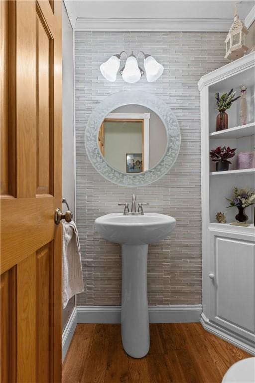 375 Navaho Hollow Rd, Coolbaugh Twp, PA 15438 - half bath featuring baseboards, wood finished floors, a sink, ornamental molding, and tile walls